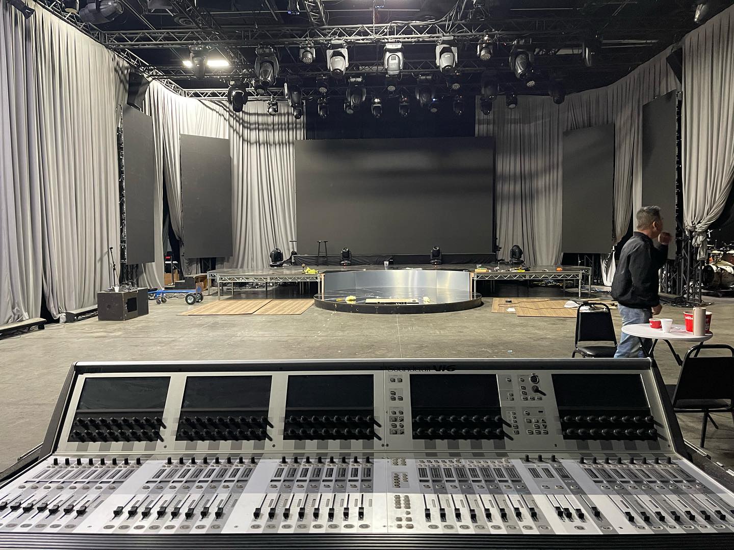 Empty venue with sound system and consoles set up before show